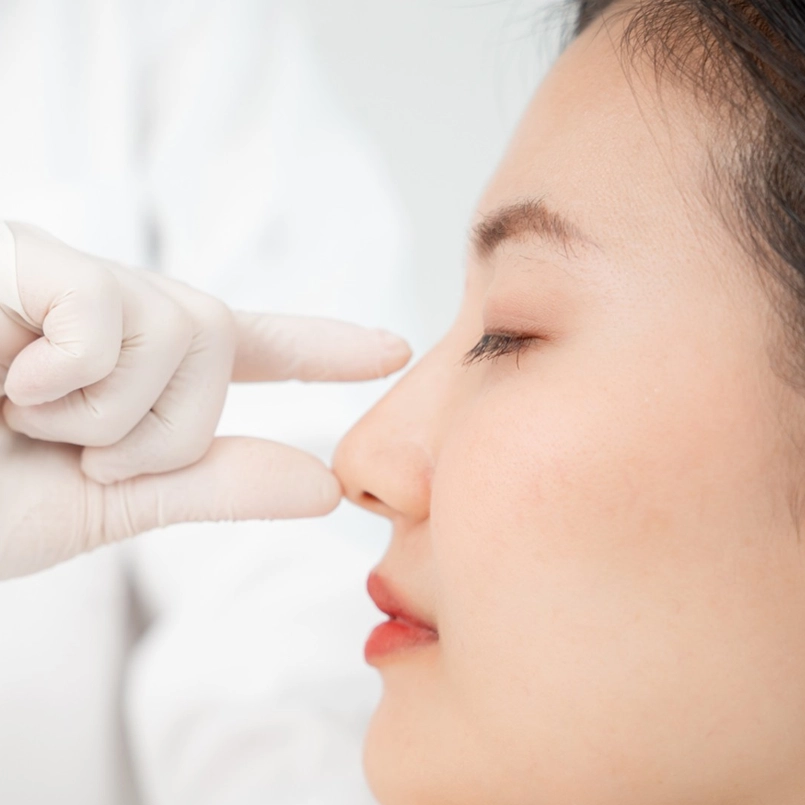 Image of fingers to nose. Photo for Marquis Plastic Surgery, Coral Gables, Miami, West Palm Beach, Florida.