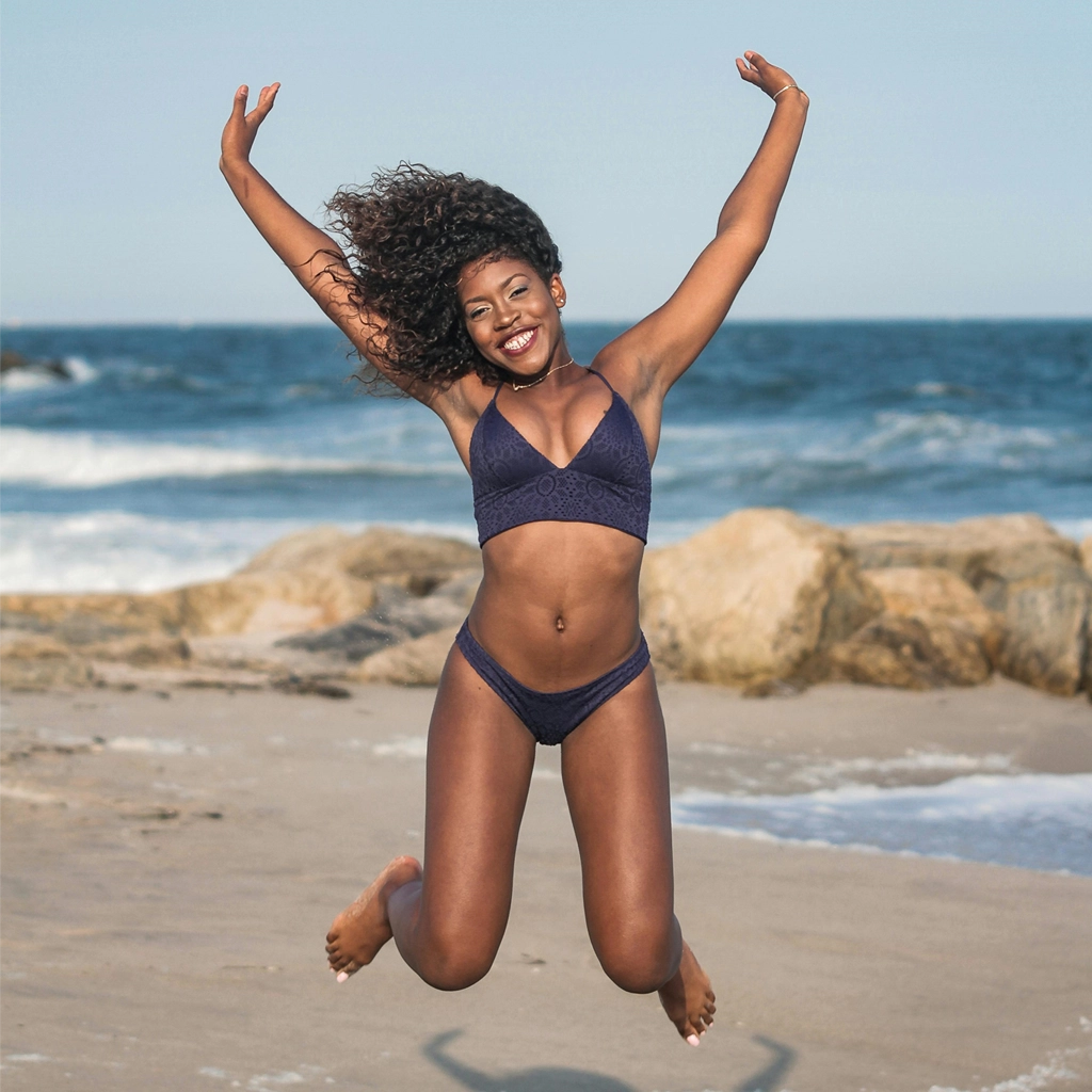Image of a woman jumping for labia minora reduction procedure. Photo for Marquis Plastic Surgery, Coral Gables, Miami, West Palm Beach, Florida.